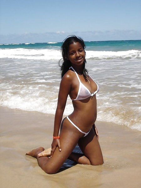 ebony cutie with sheer top at the beach