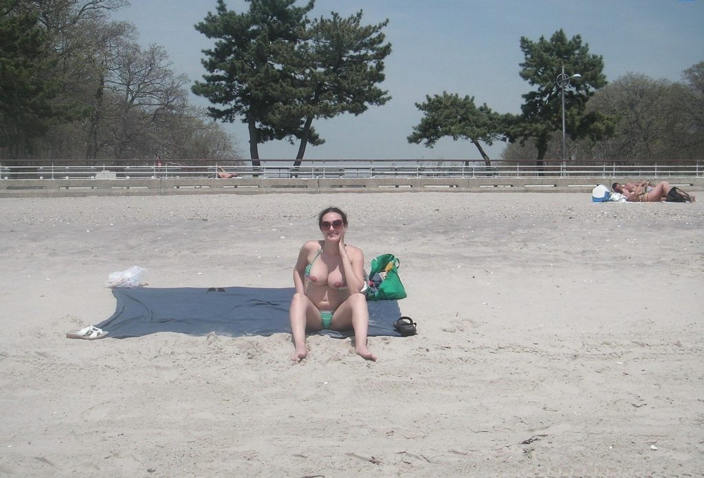 girlfriend flashing on the beach