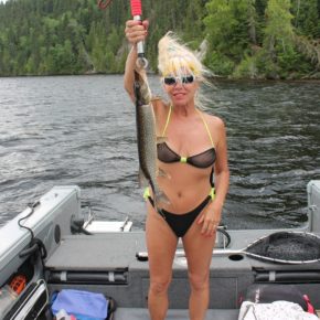 amateur fishing on the lake in a see through bikini.