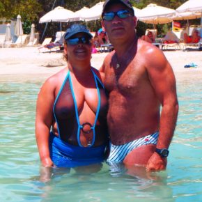 chubby mom on the beach in a see through one piece