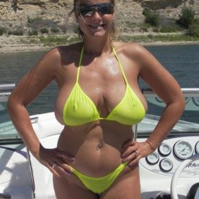 big titted milf on a boat in a sheer bikini