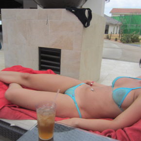 girl doesn’t care that everyone at the resort can see her pussy and tits at the pool.