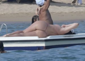 celebrity in a t-front thong and her tits out. [gallery]